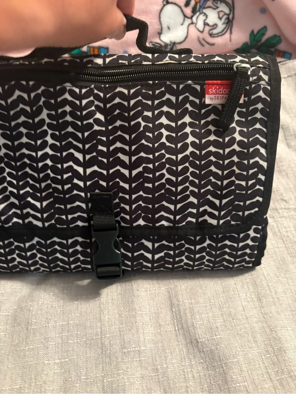 Skidaddle by Skip Hop Black & White Travel diaper bag with fold out changing pad